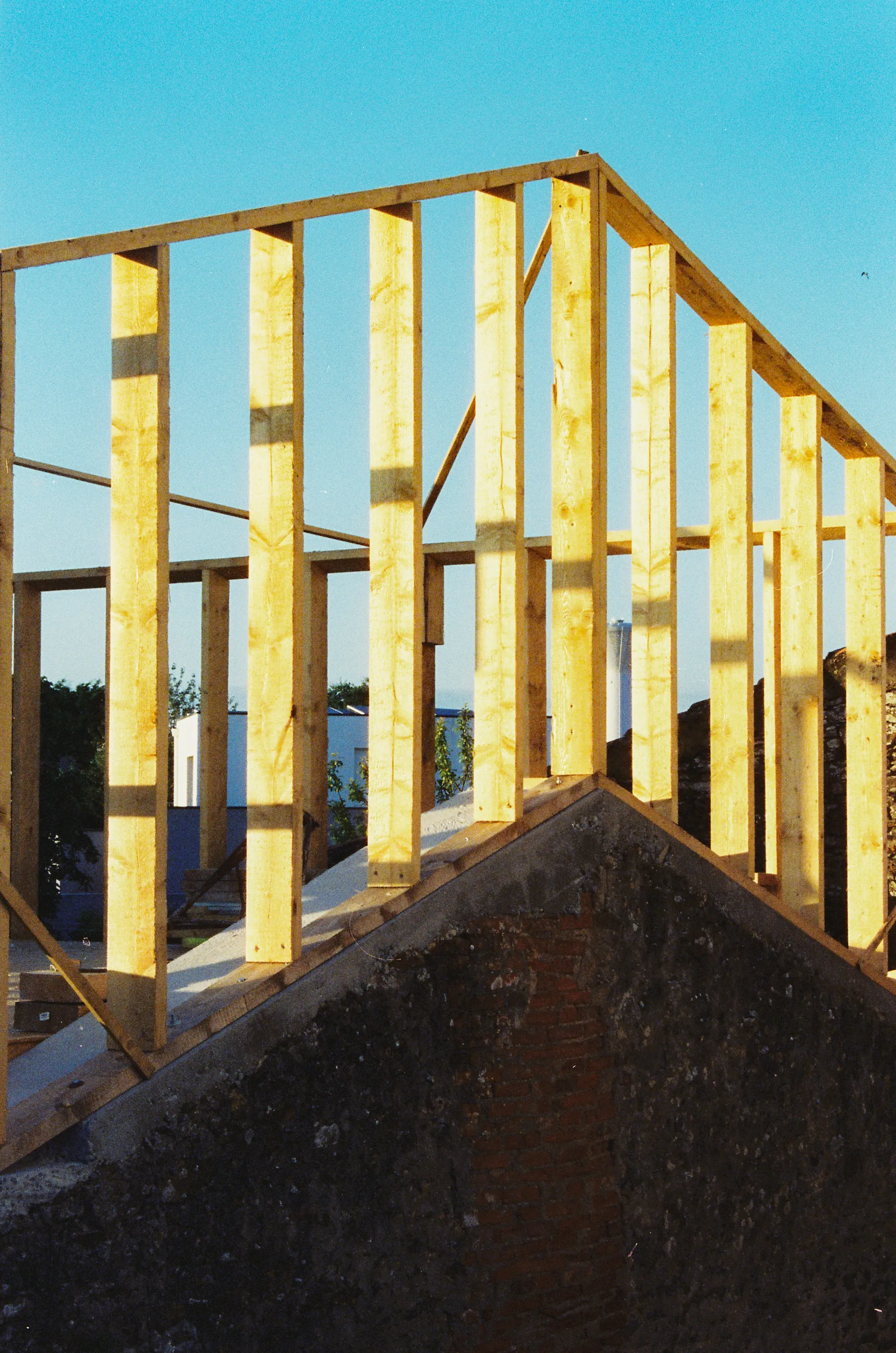 House interior opened to the studs during a whole-home renovation